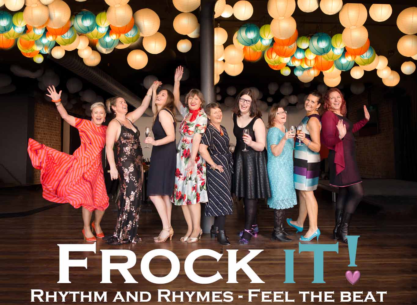 Frock IT! Rhythm and Rhymes - feel the beat. Women in dresses laughing, dancing and holding glasses of champagne